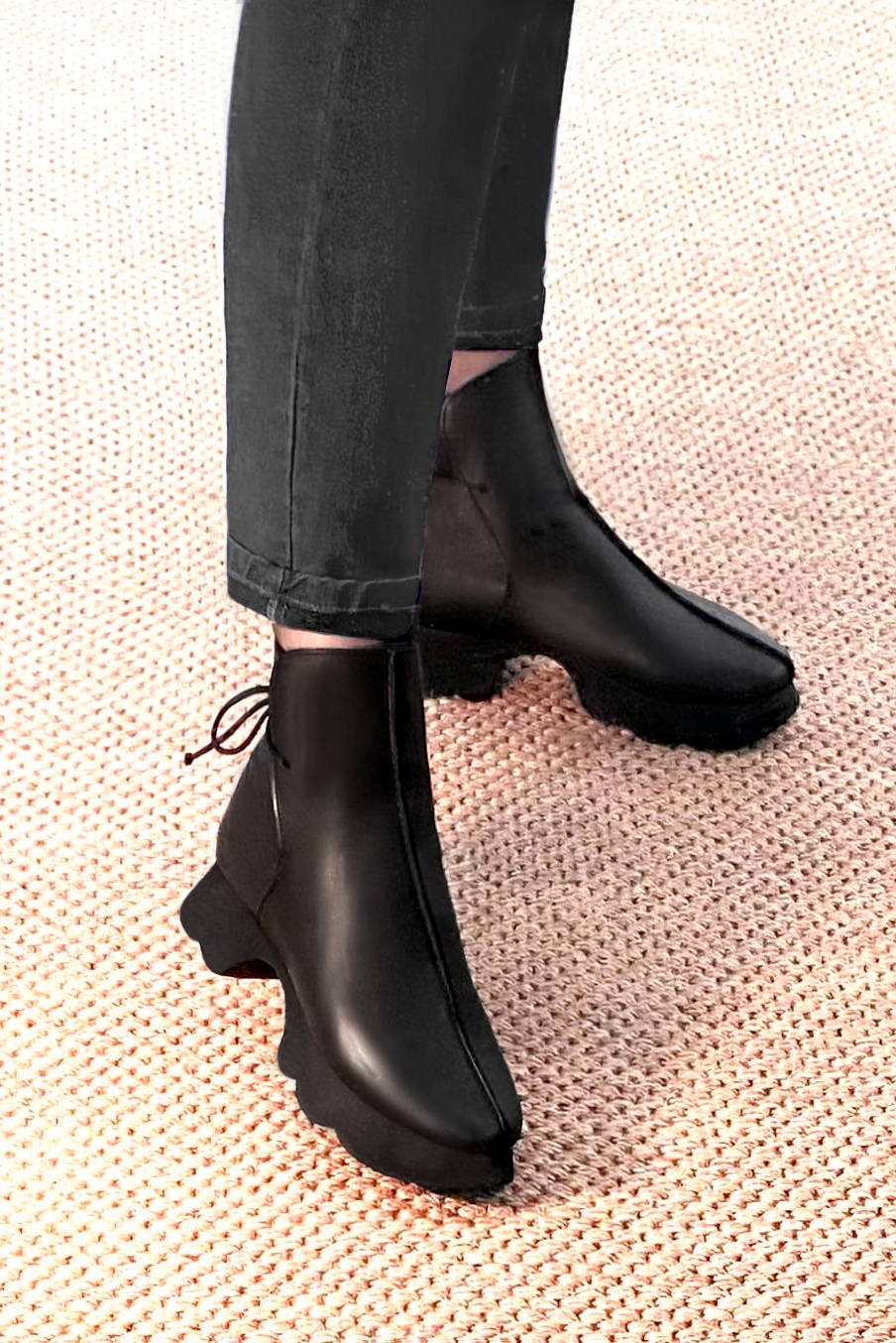 Satin black women's ankle boots with laces at the back. Round toe. Low rubber soles. Worn view - Florence KOOIJMAN